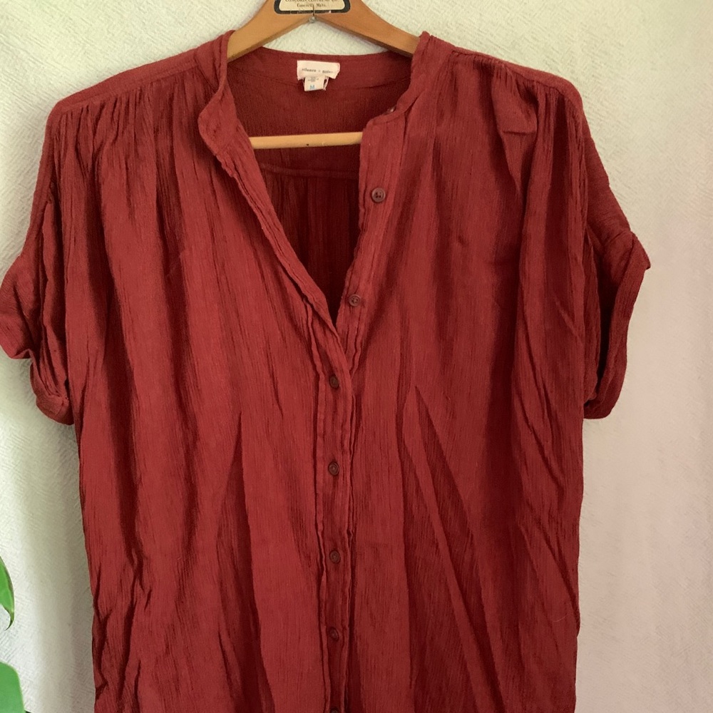 rust button down shirt